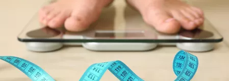 Übergewicht, Waage und Maßband Übergewicht, Waage und Maßband